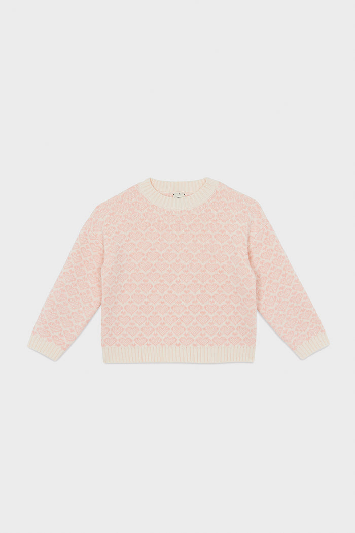 A light pink knit Pink Heart Sweater with a textured diamond pattern and cream ribbed trim from Bonton—perfect for kids’ wardrobes.