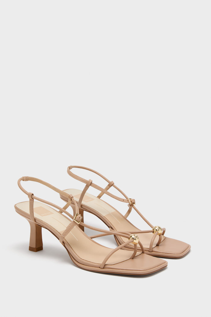 Light Tan Mylee Heels: Classic, high-end heeled sandals with an effortless, fun design featuring crisscrossing straps, gold-tone bead accents, and a mid-height block heel.