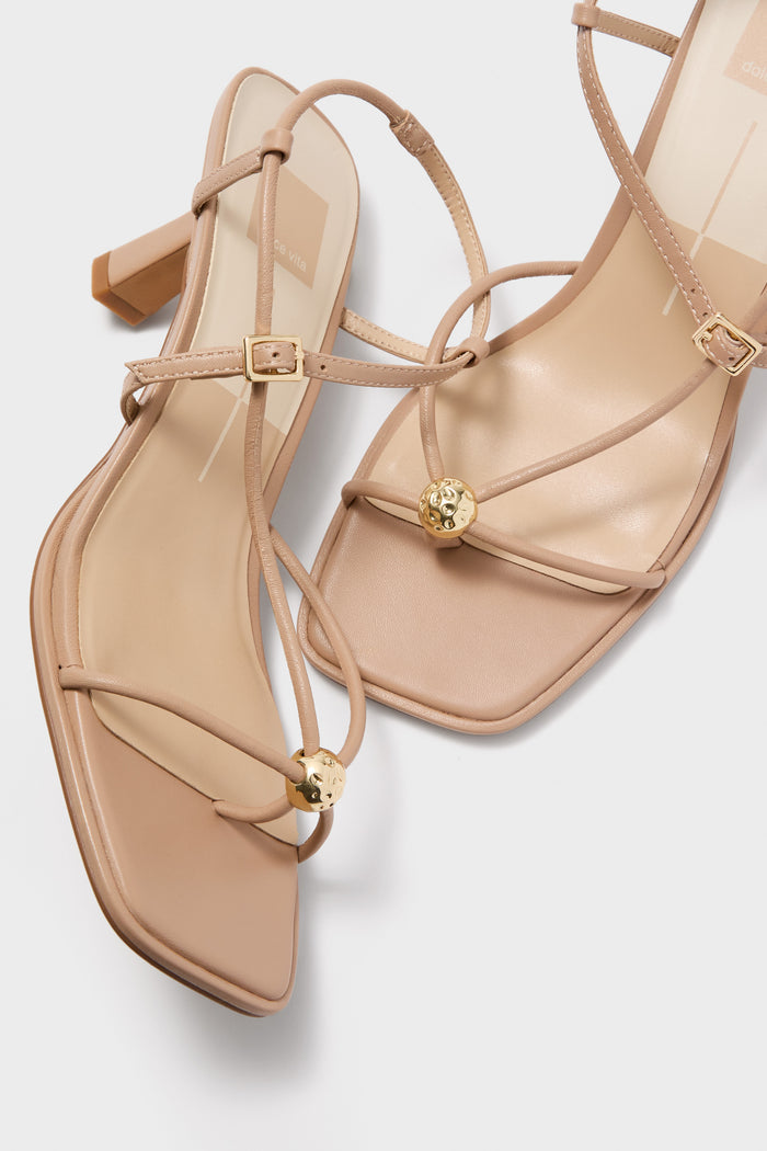 Light Tan Mylee Heels: Classic nude leather strappy sandals with square toes, low block heels, and elegant gold accents for an effortless, high-end look.