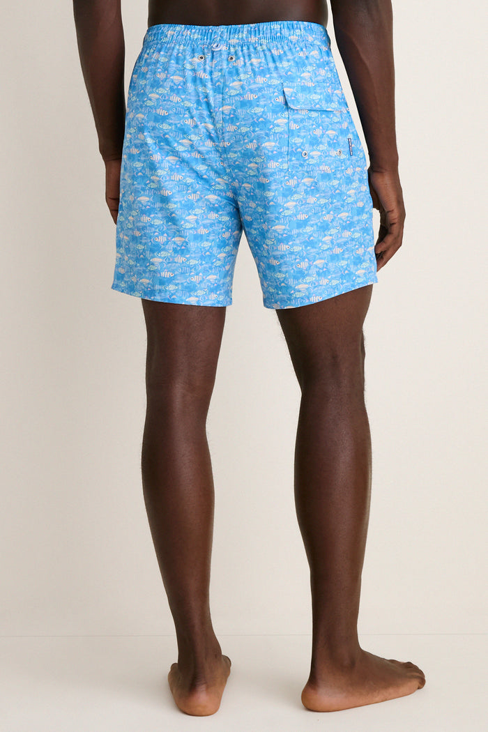 Marina Blue Sunfish Swim Trunk with fish pattern, elastic drawstring waist, and back flap pocket, offering effortless comfort and fun for high-end, classic beachwear.