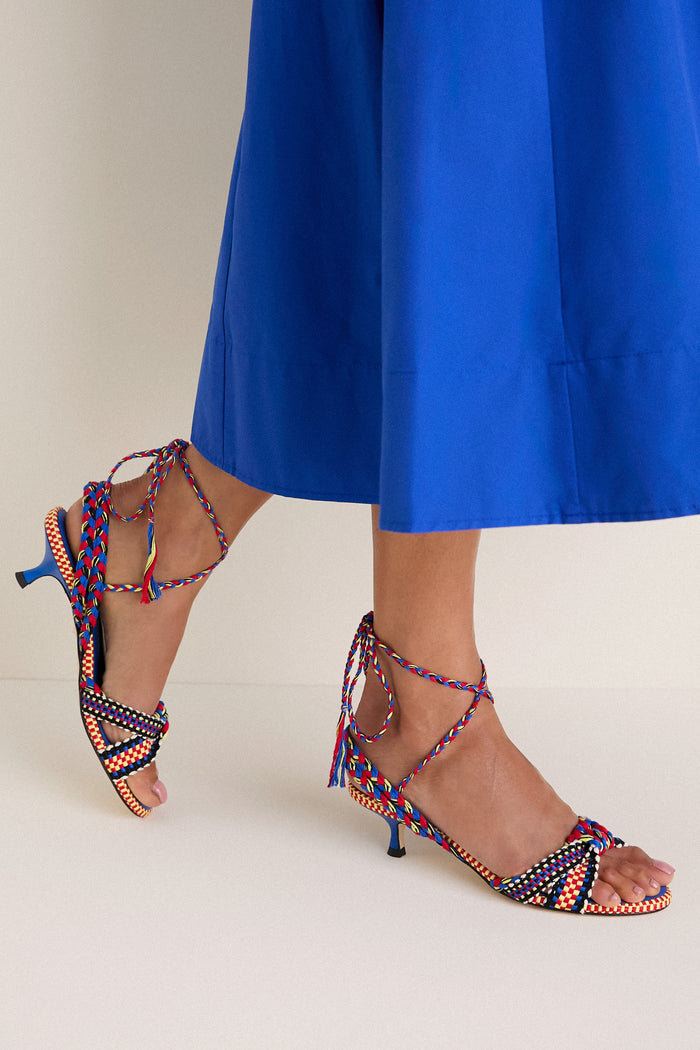 The Miro Aitana Wrap Heels feature a classic, effortless design with strappy, braided-rope details and wrap-around ankle ties, offering a fun, high-end look.