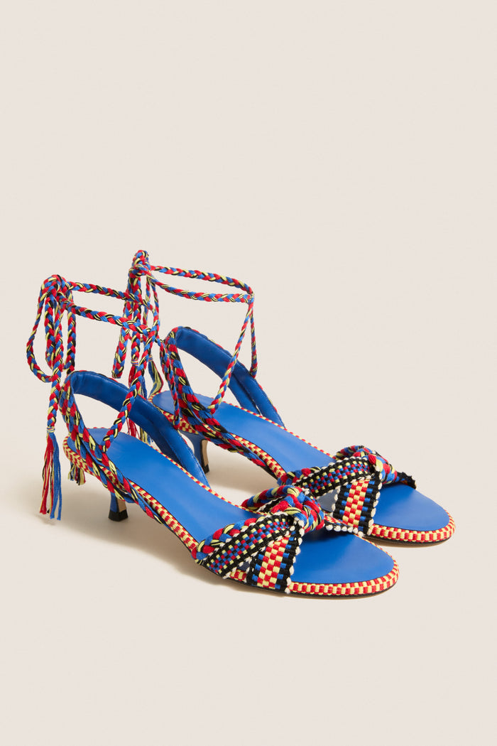 Miro Aitana Wrap Heels feature multicolored braided straps and a bright blue footbed. These classic, fun sandals offer an effortless, high-end style with slender heels.