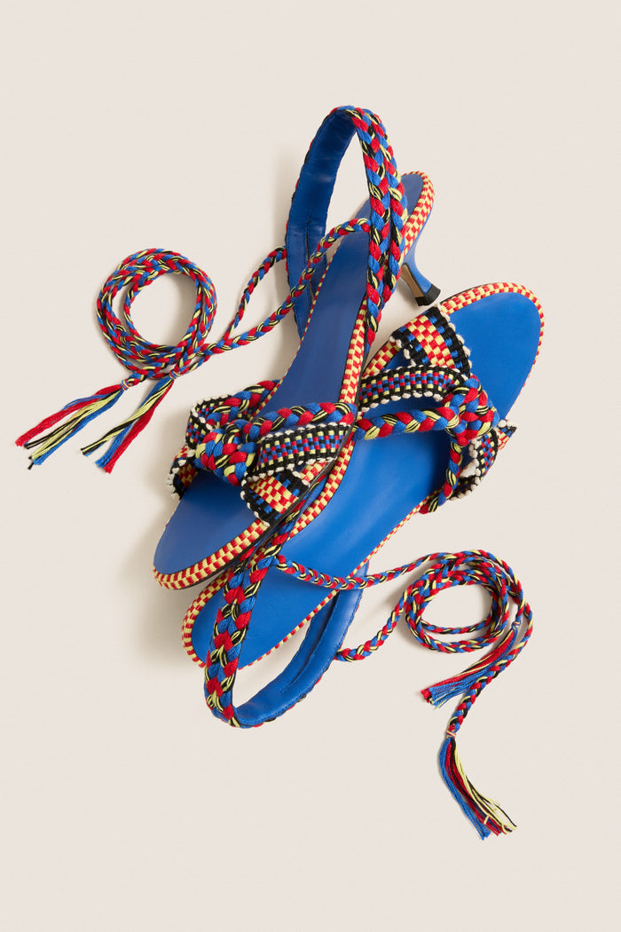 Miro Aitana Wrap Heels: Classic, high-end strappy sandals with multicolored braided straps, cobalt blue footbeds, and a low heel for an effortless, fun look.