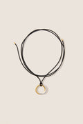 Mixed Lucy Williams Entwine Pendant Cord Necklace features a classic, effortless design with two-tone rings on an adjustable black cord, offering a fun, high-end look.