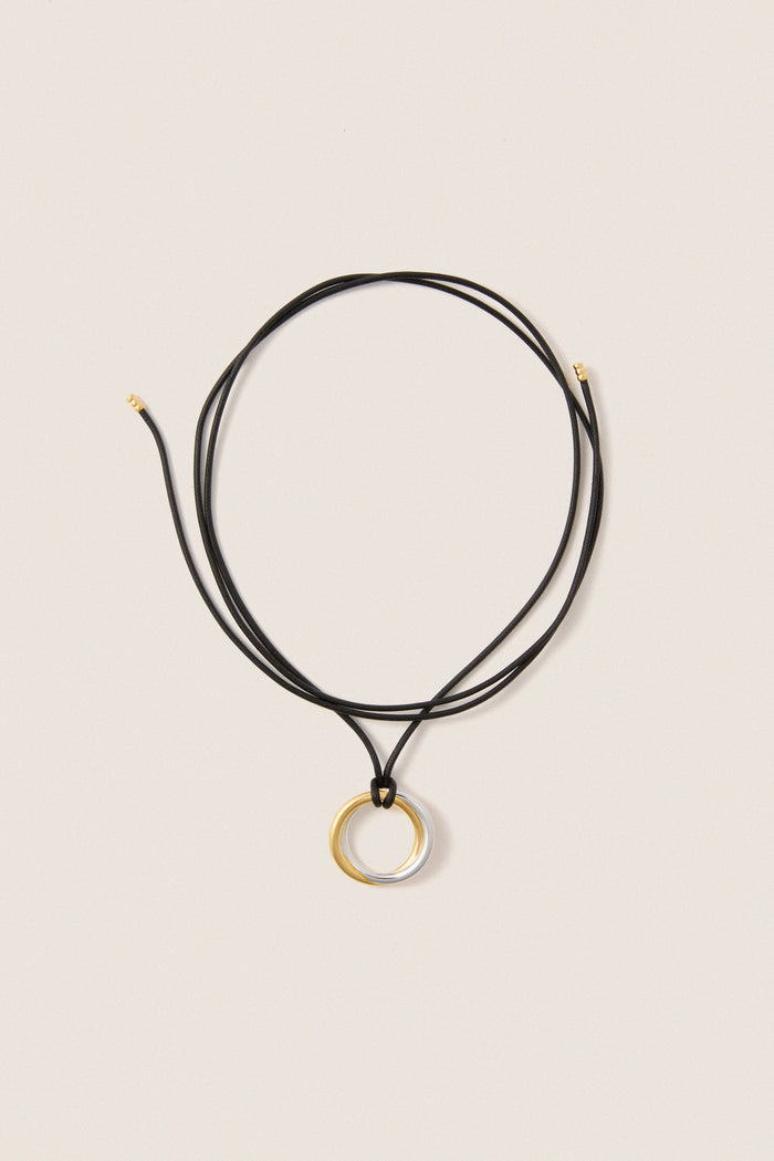 Mixed Lucy Williams Entwine Pendant Cord Necklace features a classic, effortless design with two-tone rings on an adjustable black cord, offering a fun, high-end look.