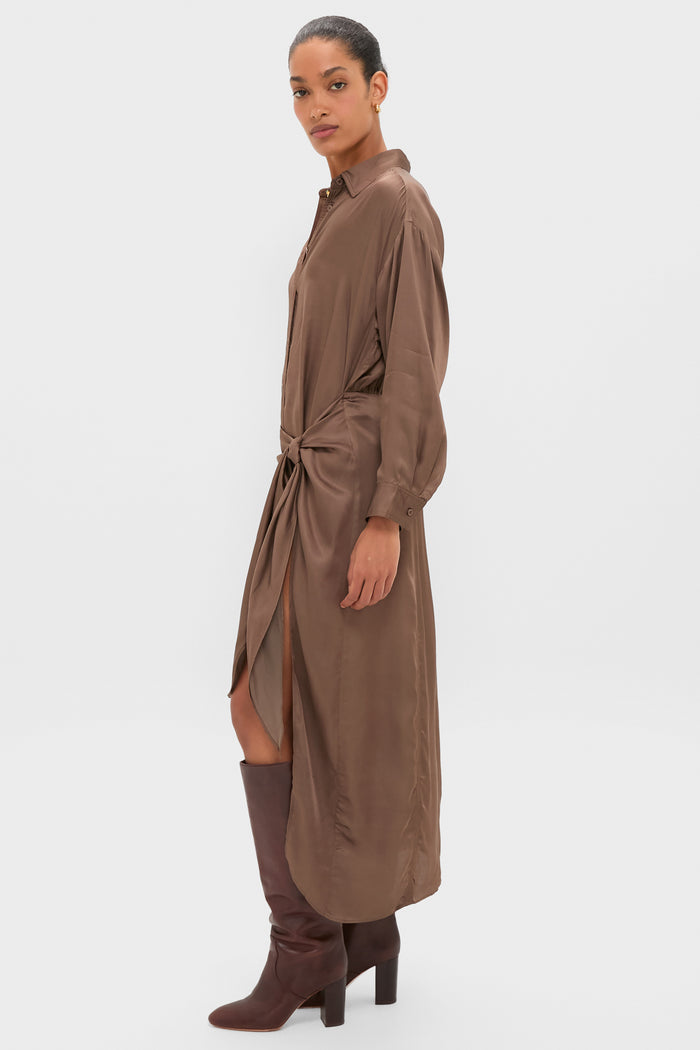 Woman models the Morel Alessandra Sarong Shirt Dress, featuring an effortless, classic silhouette with a knot detail and front slit, paired with high-end, fun mid-calf leather boots.