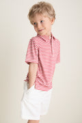 Preschool child in a classic, effortless Nantucket Red and Creme Le Club Polo, hands in pockets, embodying fun and high-end style with discrete back embroidery.