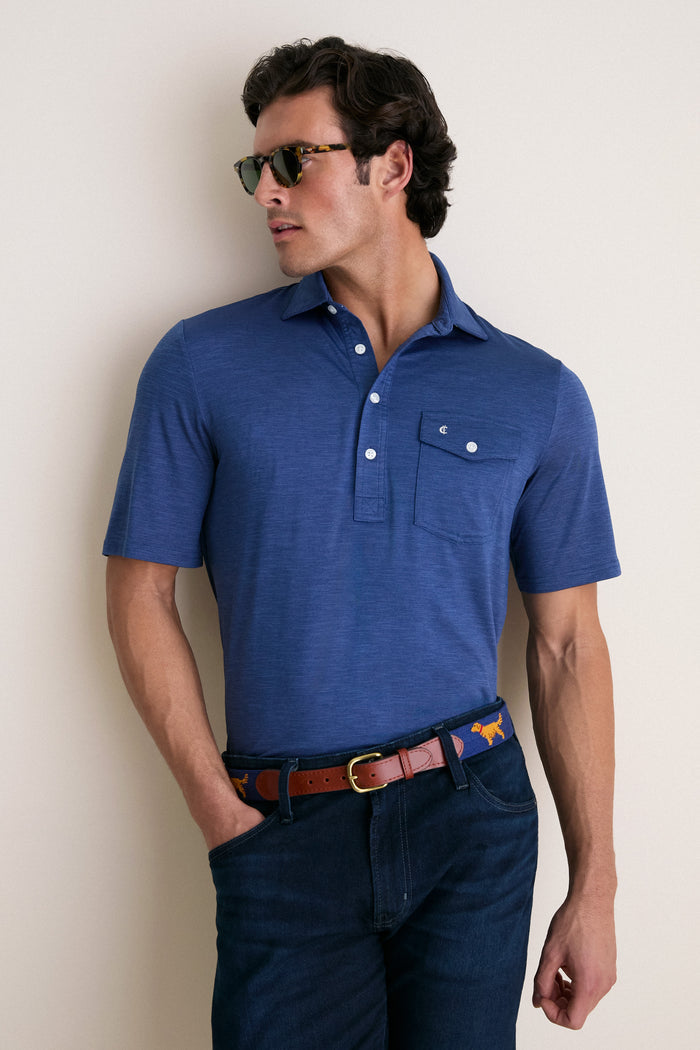 Young man wearing the Navy Captain Heather Performance Sport Players Shirt with a classic collar and chest pocket, embodying effortless style and high-end comfort.