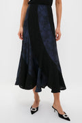 Navy Jacquard and Black Lace Mallory Skirt features an effortless, high-end A-line silhouette with an asymmetrical hem, paired with classic pointed-toe mule heels for a fun look.