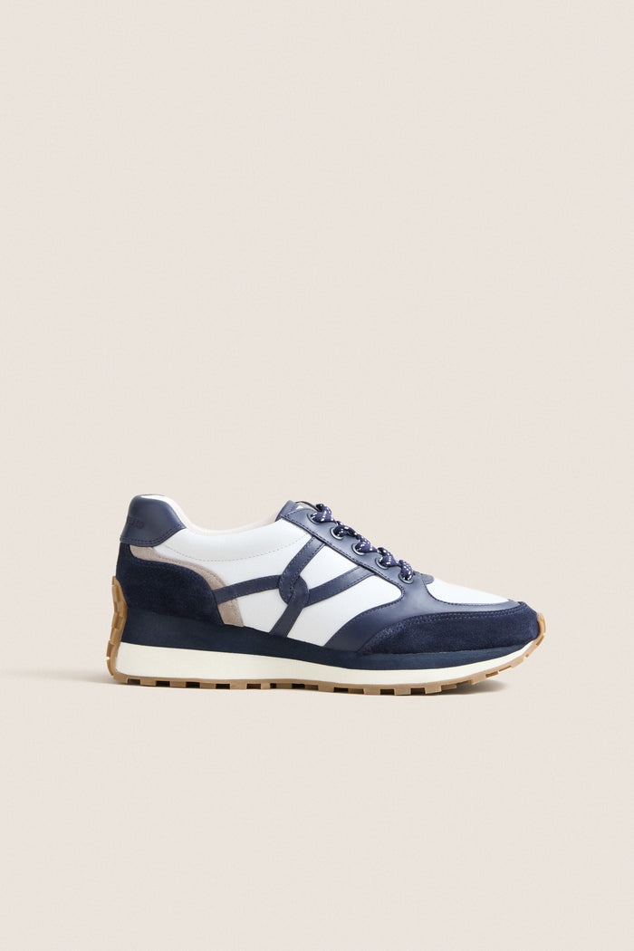 Navy Multi Valentina Sneakers feature a classic, effortless design with navy and white leather, suede overlays, and a gum-rubber sole, perfect for high-end, fun everyday wear.