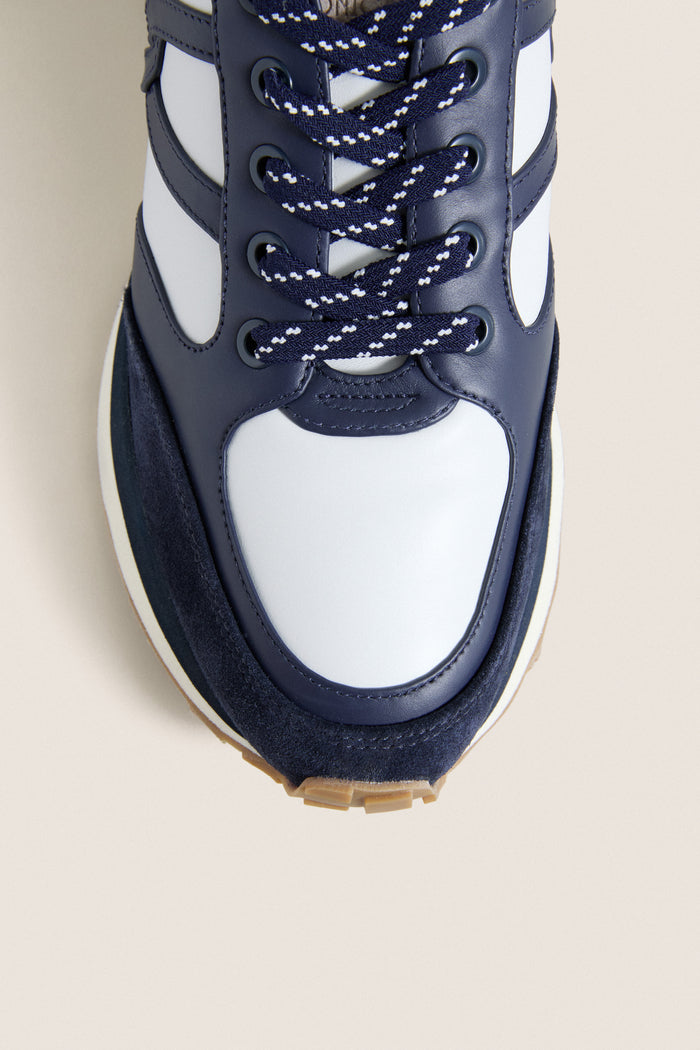 Navy Multi Valentina Sneakers featuring a classic white leather upper, navy suede toe, and effortless patterned laces. A fun, high-end everyday shoe.