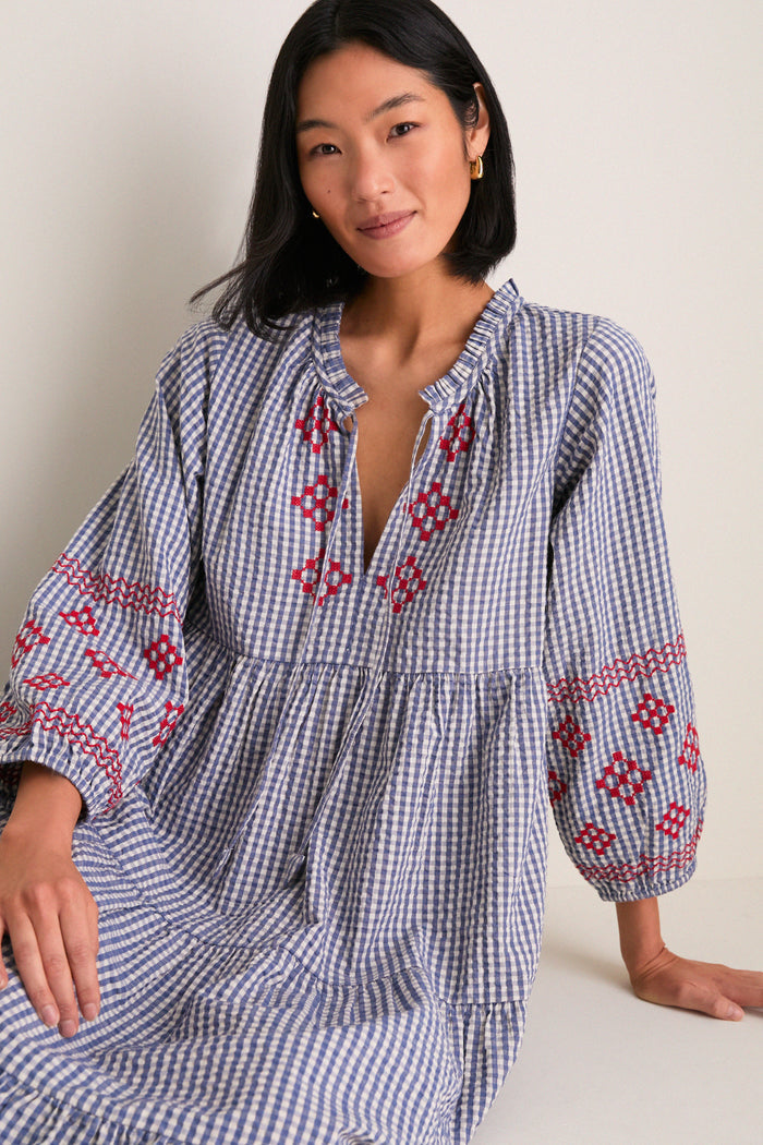 Navy Prism Embroidered Gingham Long Sleeve Salty Paloma Caftan, classic and effortlessly chic with tiered skirt and embroidered sleeves, perfect for fun, high-end style.