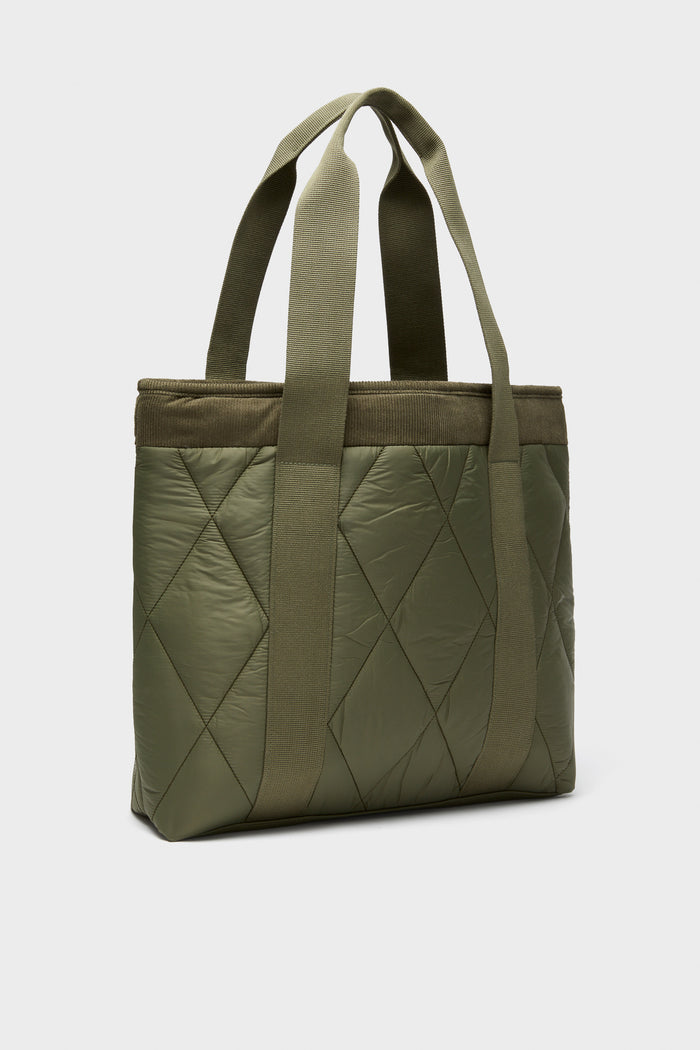 Olive Healy Tote Bag: A classic, high-end accessory with diamond quilting and effortless design, featuring webbed handles and ample space for essentials.