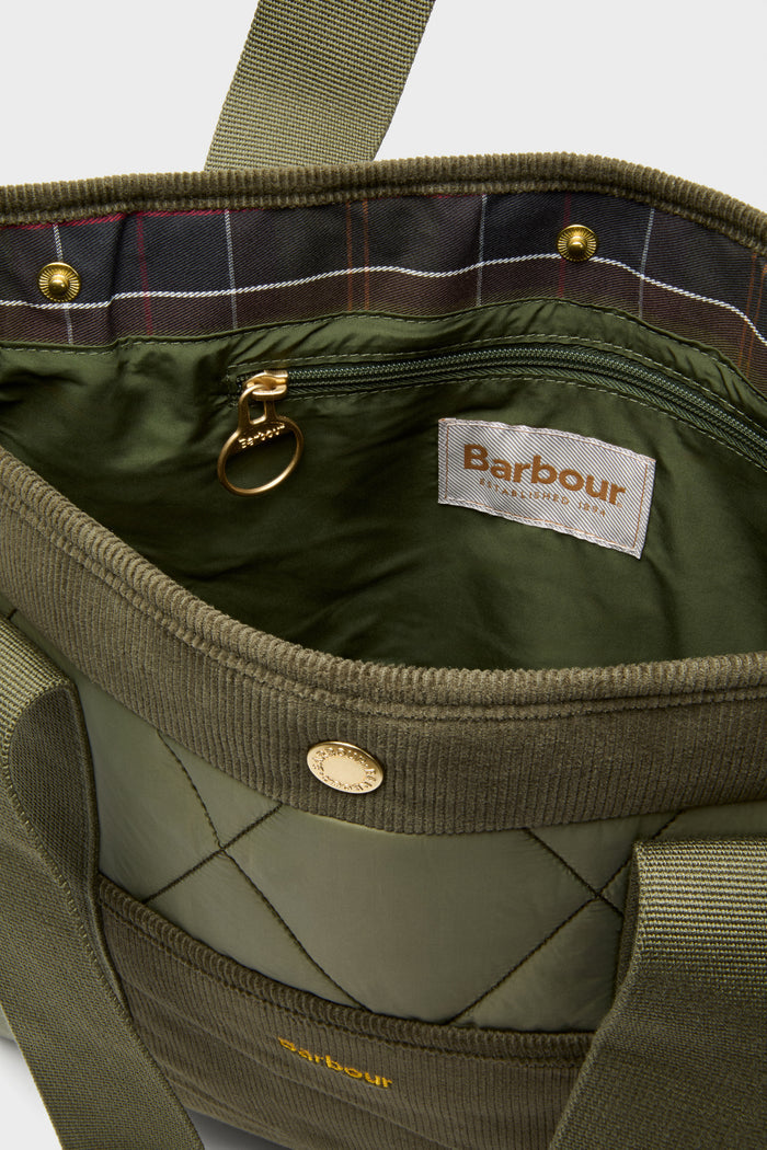 Olive Healy Tote Bag, classic and fun with quilted design, tartan-lined interior, snap closure, and webbing handles, embodies effortless high-end style and functionality.