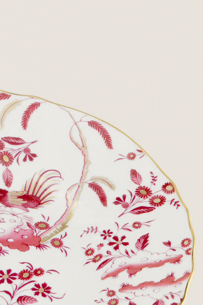 Oro Di Doccia Magenta Salad Plate, classic and high-end, features an effortless hand-painted red floral and rooster motif, gold-trimmed scalloped edge, embodying fun elegance.