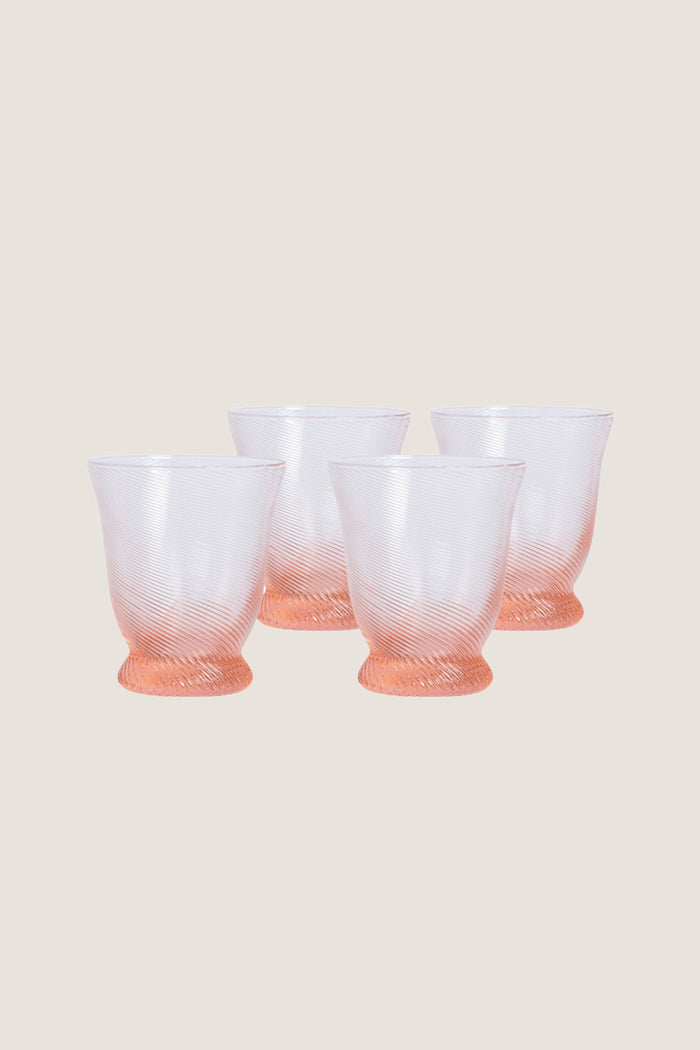 Peony Pink Spiral Tumbler (Set of 4), featuring classic rib-patterned, swirled texture with a flared silhouette, offers an effortless, high-end touch to any fun tablescape.