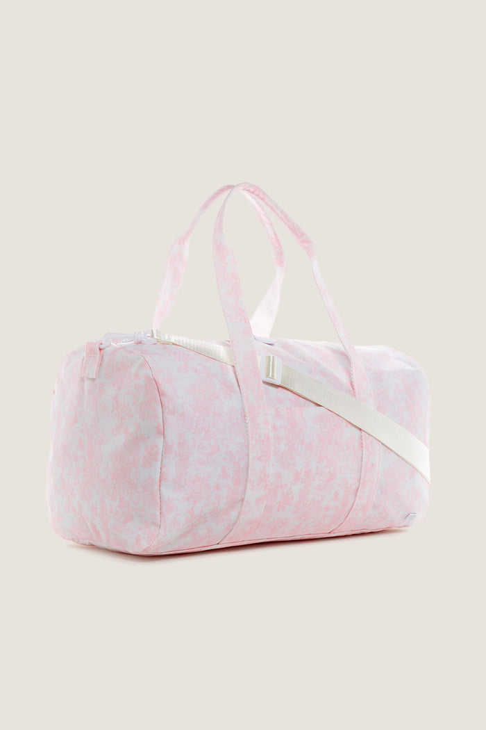 Classic Pink Bunny Toile Weekender Duffel Bag with an effortless, fun marbled design. Features include a detachable shoulder strap, two-way zipper, and interior mesh pocket for high-end practicality.