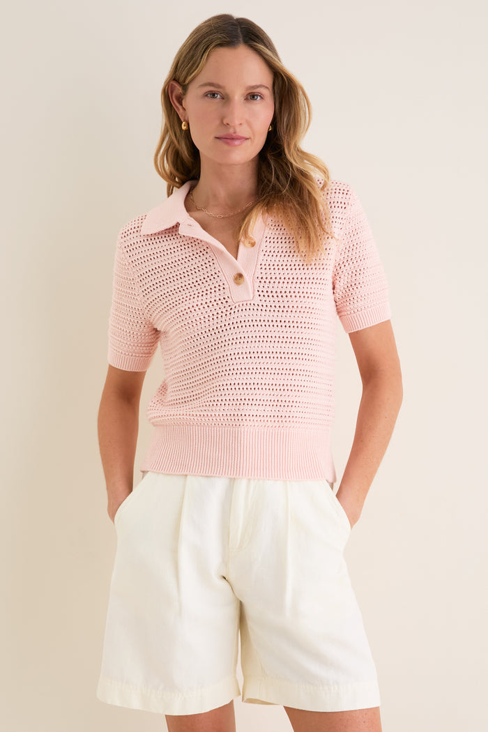 Woman wearing Pink Crochet Cotton Asher Polo, showcasing its classic, effortless design with a three-button placket and relaxed fit, embodying high-end, fun style.