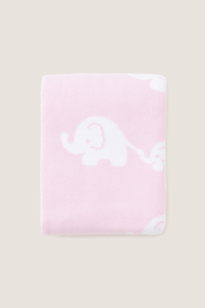 Pink Elephant Knit Blanket, featuring classic white elephant silhouettes on soft pink. Made from high-end, ultra-soft cotton for effortless comfort and fun snuggles.