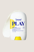 Play Sunscreen Stick SPF 50 1.5oz in a sleek white-and-yellow applicator, offering effortless, high-end sun protection with a clear, mess-free application.