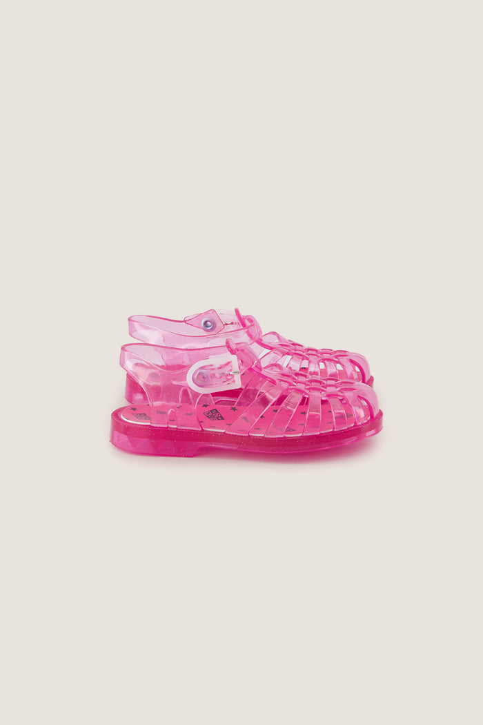 Classic Rose Jelly Meduses Sandals, effortlessly fun and high-end, ideal for beach or playground adventures, crafted from 100% PVC in a bright-pink caged design.