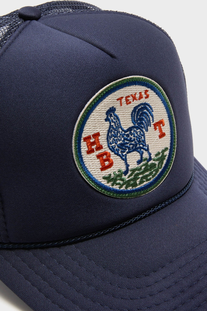 Round Top Trucker Hat with a classic embroidered rooster patch, featuring TEXAS and HT. Effortless style with fun rope detail, perfect for high-end casual wear.