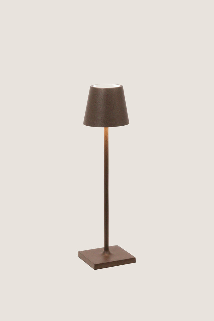 Rust Poldina Pro Table Micro Lamp: a classic, effortless cordless lamp with touch control, perfect for indoor/outdoor use. High-end design for fun, versatile lighting.