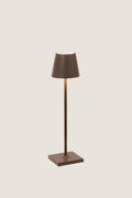 Rust Poldina Pro Table Micro Lamp: a classic, effortless cordless lamp with touch control, perfect for indoor/outdoor use. High-end design for fun, versatile lighting.