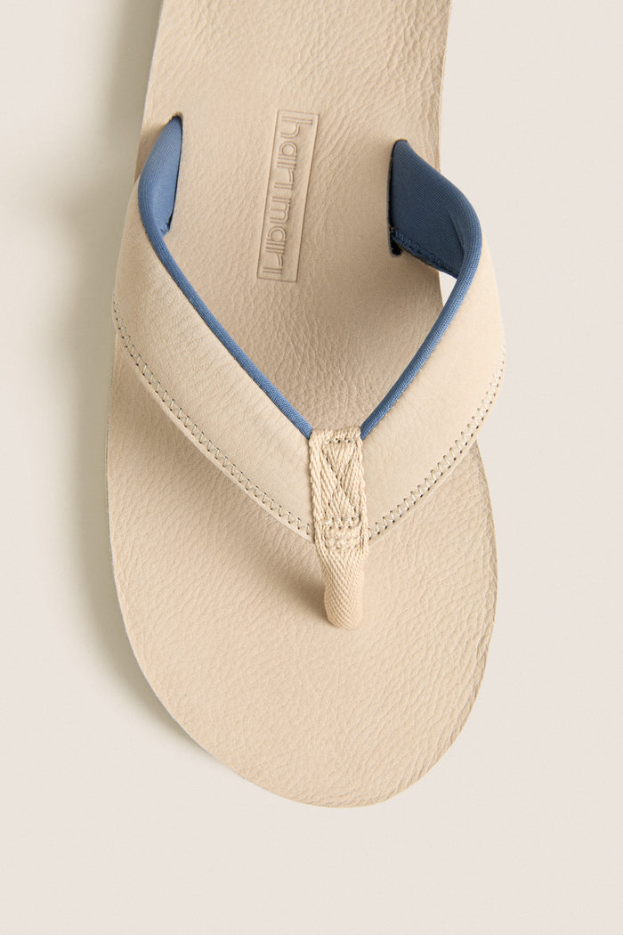 Classic Sand Pier Pebbled Leather Sandal, featuring an effortless pebbled texture and fun woven toe post, embodies high-end comfort and style for any adventure.