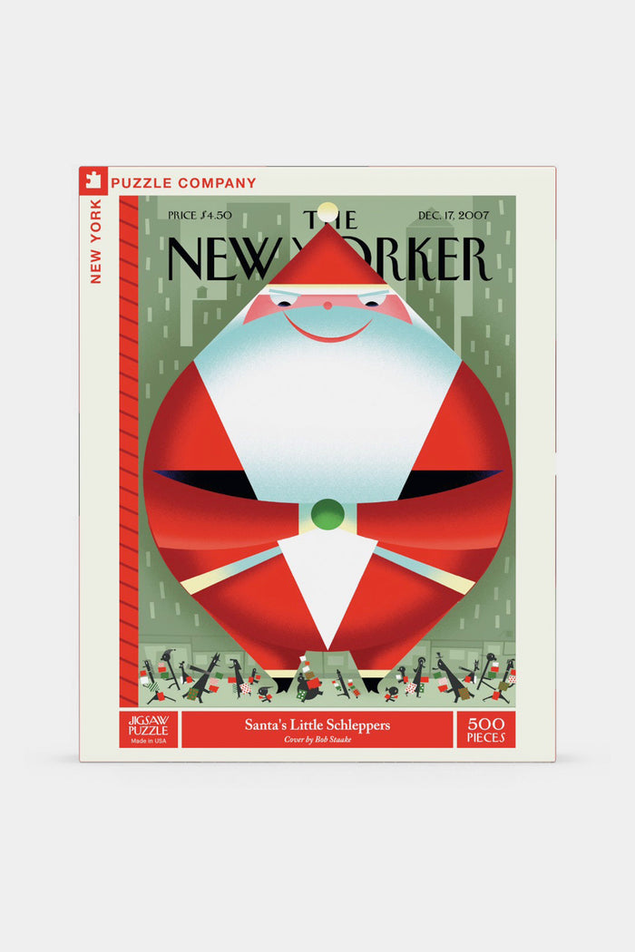 The New York Puzzle Company’s “Santa’s Little Schleppers” is a 500-piece jigsaw puzzle featuring Bob Staake’s geometric Santa and elves, originally a New Yorker cover.