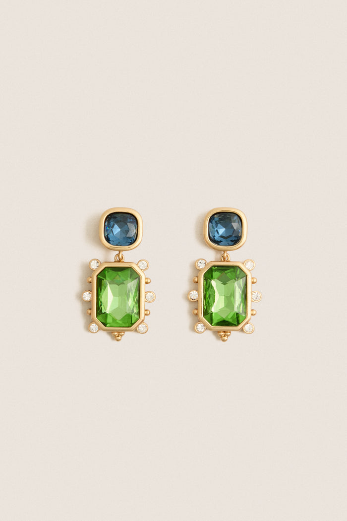 Sapphire and Emerald Fantasia Earrings: Classic drop earrings with blue and green faceted stones, accented by crystals. Effortless, high-end style for any outfit.