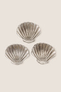 Silver Clam Shell Tidbit Dishes (Set of 3) embody classic coastal elegance with their effortless, high-end design, perfect for fun and stylish entertaining. Crafted in polished, recycled aluminum.