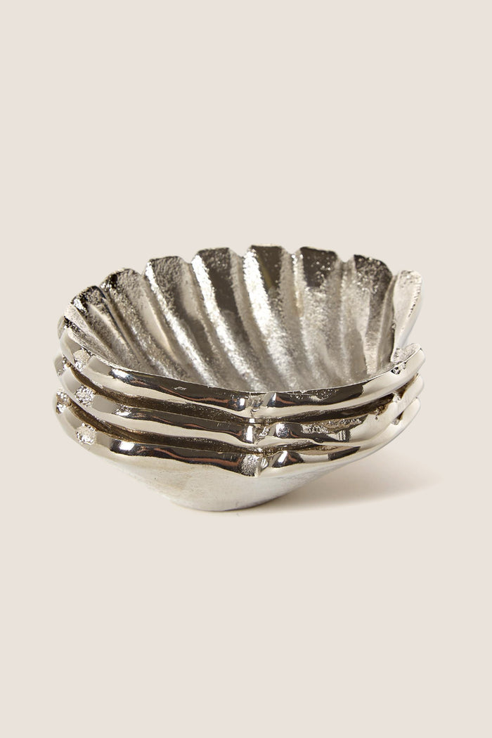 Silver Clam Shell Tidbit Dishes (Set of 3) feature classic, scalloped-edge design; effortlessly fun and high-end for serving appetizers, aligning with Tuckernuck's cool, confident style.