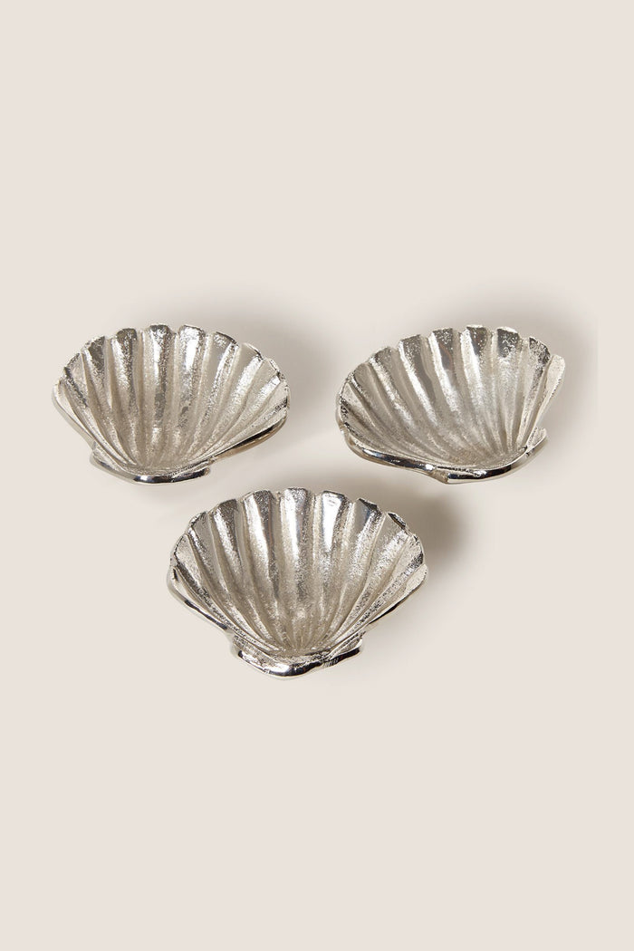 Silver Clam Shell Tidbit Dishes (Set of 3) crafted from recycled aluminum, offer a classic, high-end touch; perfect for effortless, fun entertaining with coastal elegance.