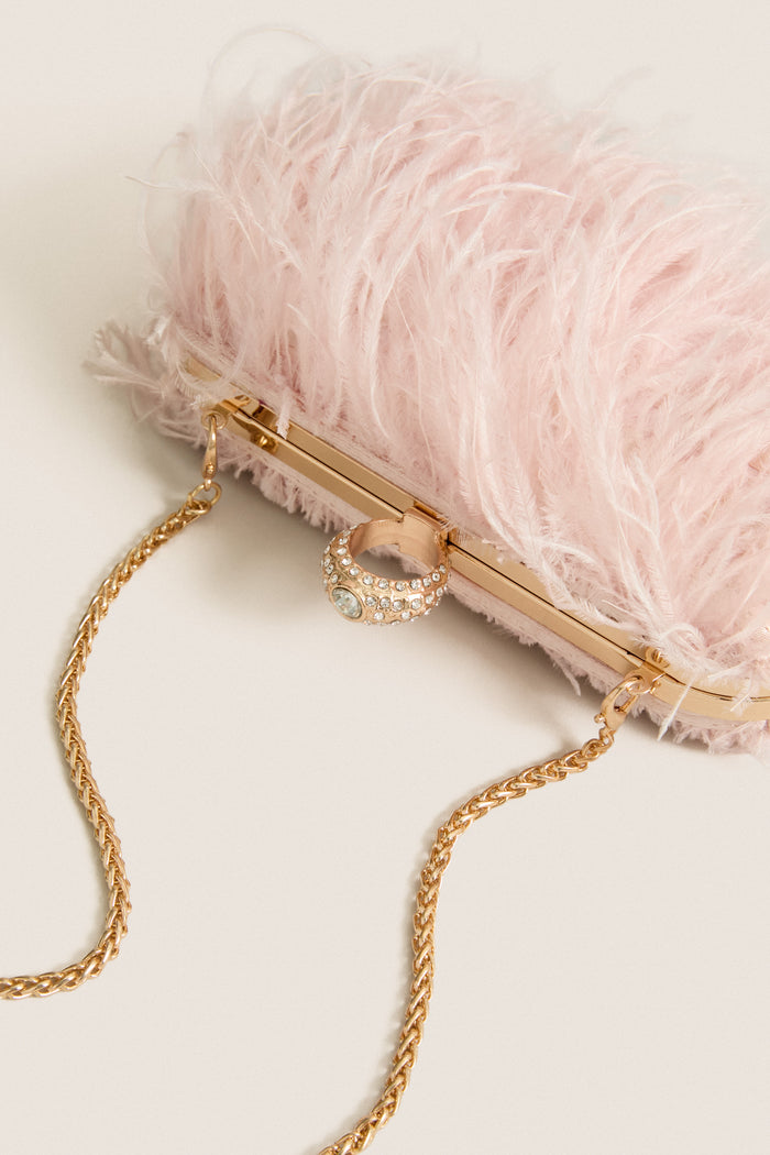 Soft Pink Harlow Bag with ostrich feather trim, gold-tone frame, rhinestone clasp, and detachable chain strap. A classic, high-end accessory for effortless elegance and fun outings.