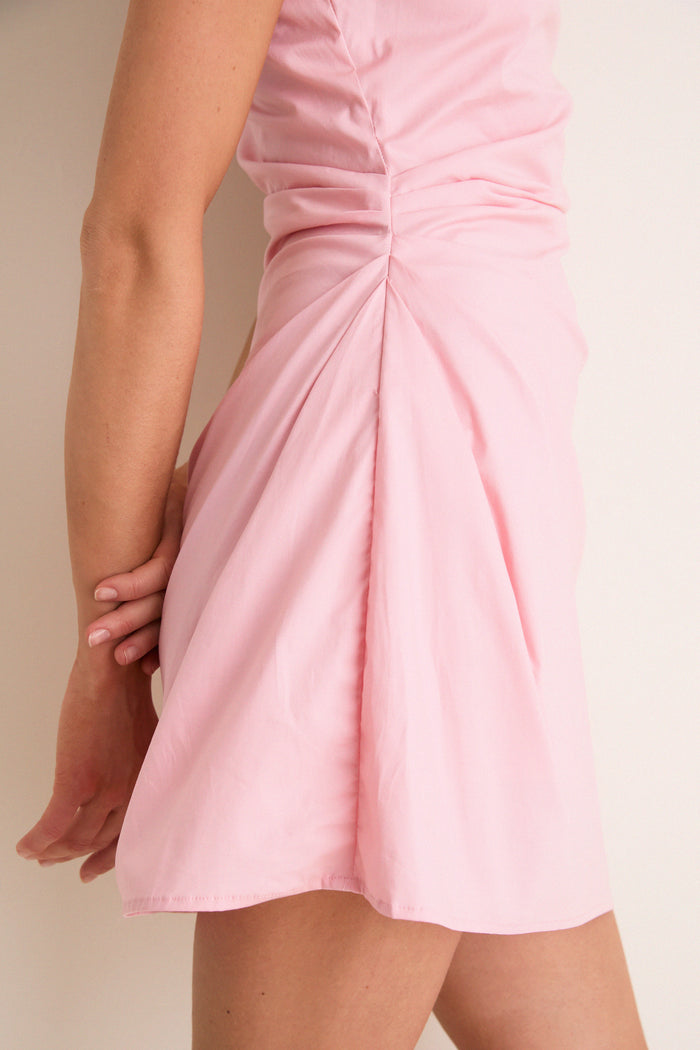 Tulip Callie Mini Dress in light pink, featuring a classic high neckline and ruched waist, offers an effortless, high-end silhouette for fun, versatile styling.