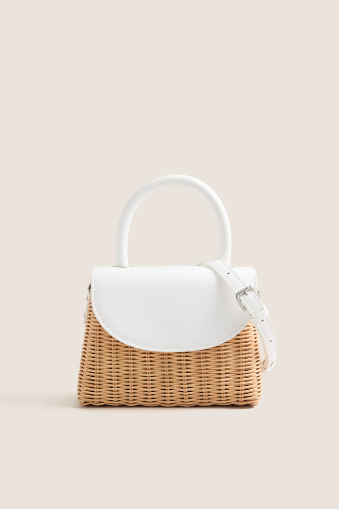 White Elle Wicker Top Handle bag with white vegan leather accents and detachable strap, offering a classic, effortless, high-end style for fun summer occasions.