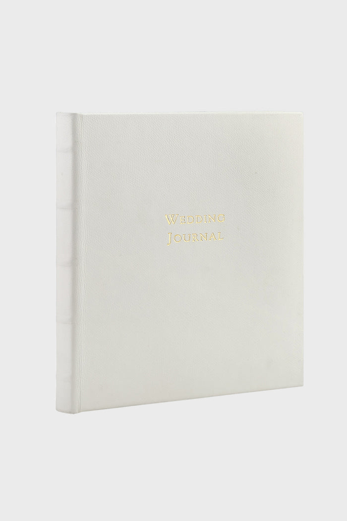 White Pebble Wedding Journal: A classic, high-end leather-bound book with gold-embossed Wedding Journal, offering an effortless, fun way to document wedding details and memories.