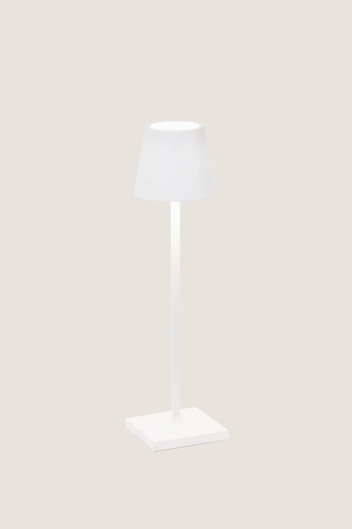 White Poldina Pro Table Micro Lamp with a classic, modern design; features touch control, dimmable LED, and cordless use, perfect for effortless indoor or outdoor illumination.