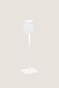 White Poldina Pro Table Micro Lamp with a classic, modern design; features touch control, dimmable LED, and cordless use, perfect for effortless indoor or outdoor illumination.
