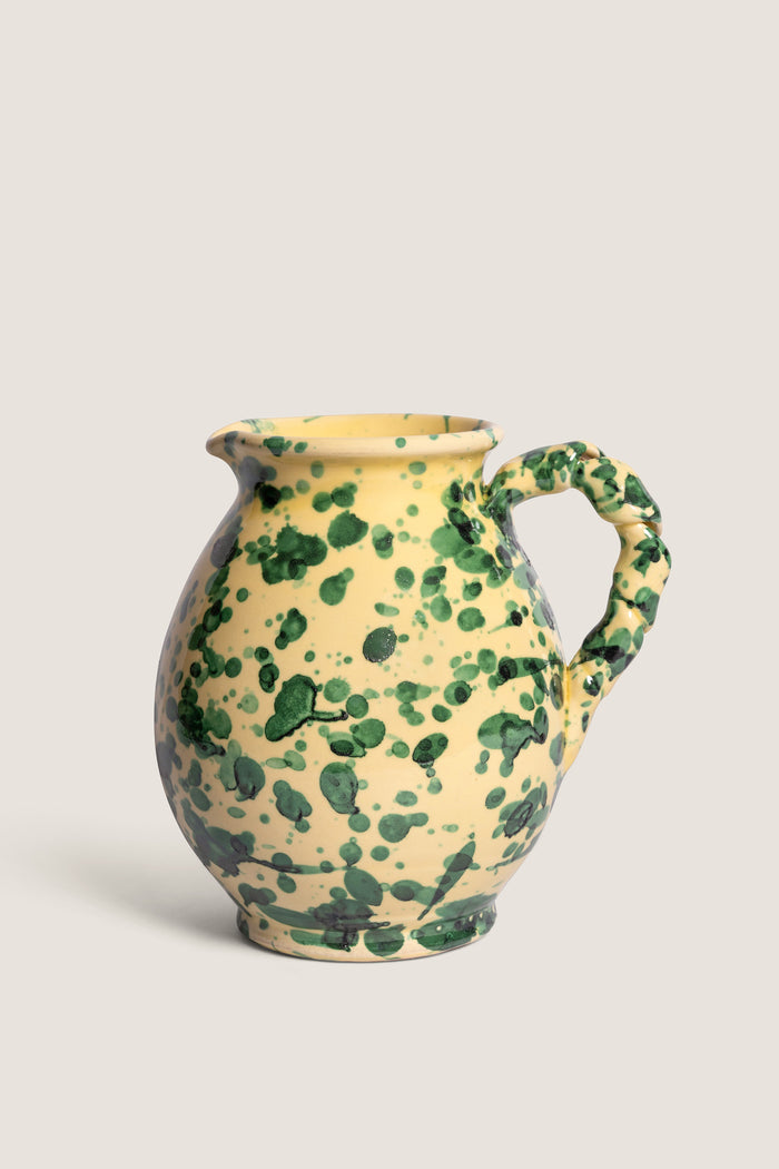 Classic and high-end, the Yellow and Verde Splatter Cigno Jug embodies effortless artistry with its fun, handmade Italian design featuring a vibrant yellow base and dark green spots.